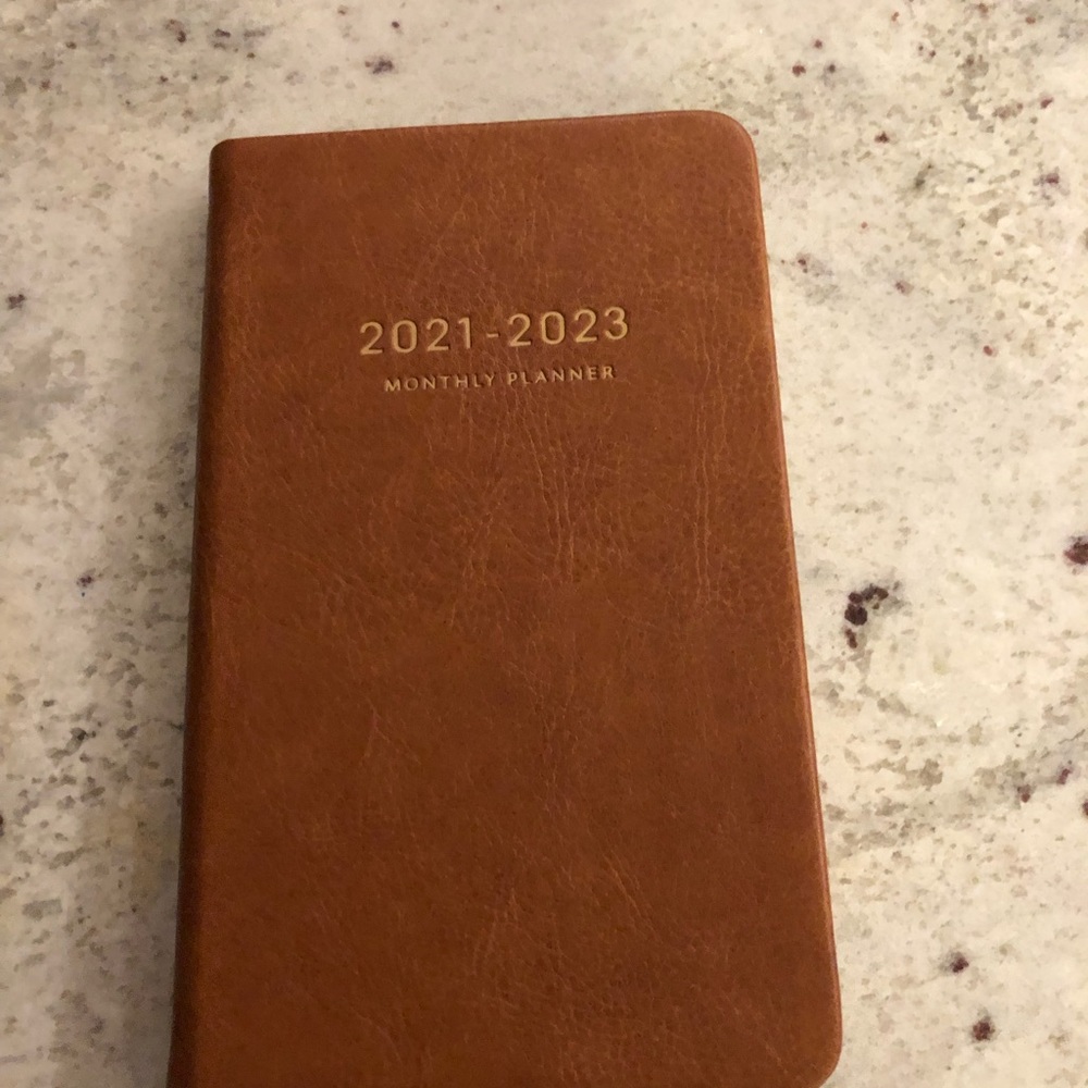 Pocket size journal with a pen loop and closure rap